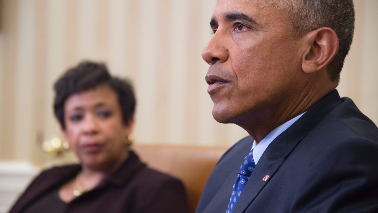 US President Barack Obama speaks with Attorney Genral Loretta Lynch in the Oval Office of the White House in Washington, DC, January 4, 2016. 