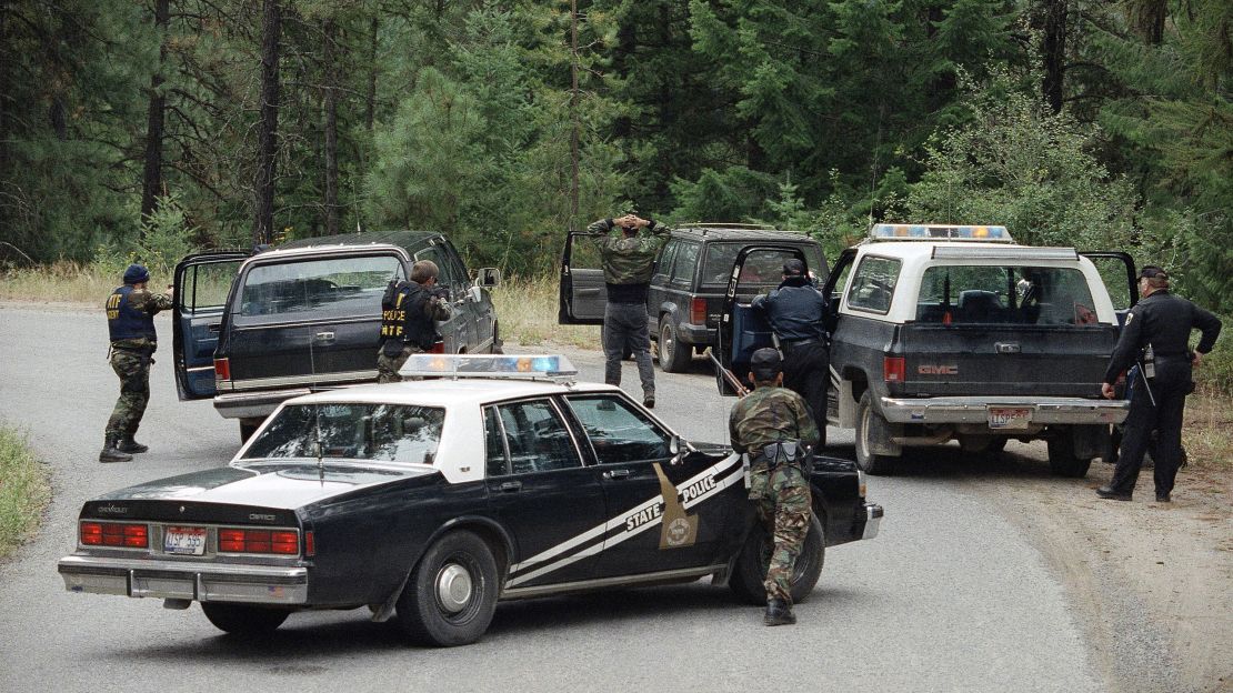 Agents place the first of five neo-Nazis under arrest near Naples, Idaho, on August 25, 1992. Weapons were found in the group's car near a police barricade three miles from the site of a standoff with Randy Weaver.