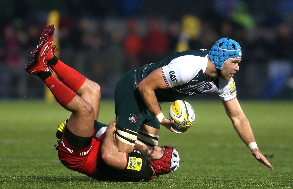 Leicester's Graham Kitchener is brought down by Saracens' Schalk Brits during a Premiership match in Barnet, England, on Saturday, January 2.