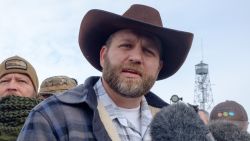 Ammon Bundy(R), leader of a group of armed anti-government protesters speaks to the media as other members look on at the Malheur National Wildlife Refuge near Burns, Oregon January 4, 2016. 