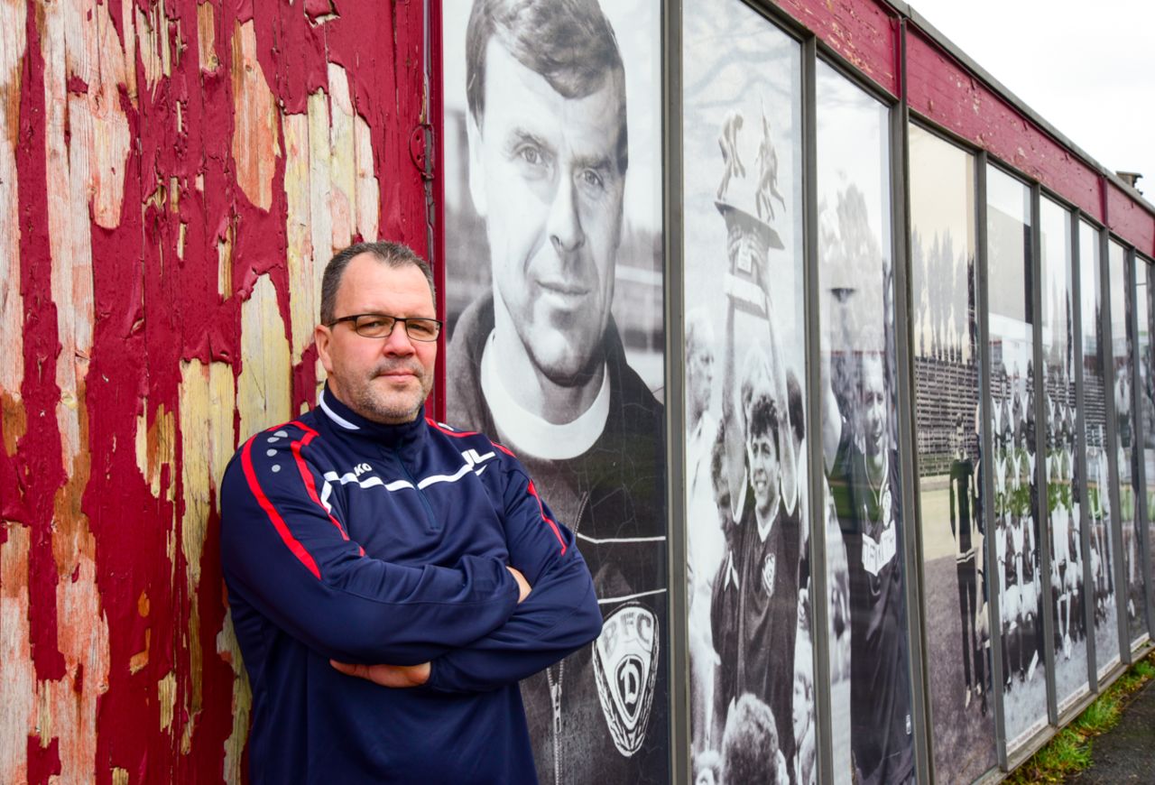 BFC manager Jörn Lenz, 46, a former midfielder for the club, stands next to photos of the team's past successes. BFC won East Germany's Oberliga for 10 successive years between 1979 and 1988.