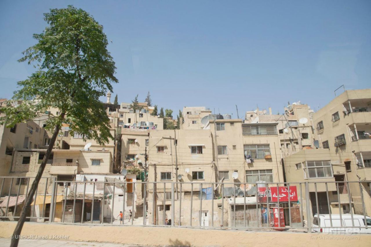 An increasing number of refugees are now living in cities rather than official camps. Cities bring  greater economic opportunities but often poor living conditions. Approximately 75% of Jordan's refugee population live in urban settings such as Amman (pictured). 