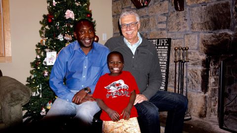Dunia poses with Dr. Leon Klempner, right, and park ranger Andre Bauma.