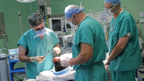 Surgeons work on Saline Atieno.