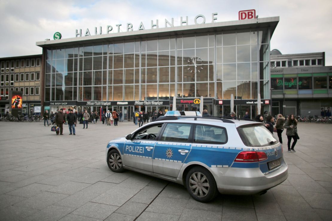 A police car passes the central railway station in Cologne, Germany near where a series of sex assaults allegedly occurred on New Year's Eve.
