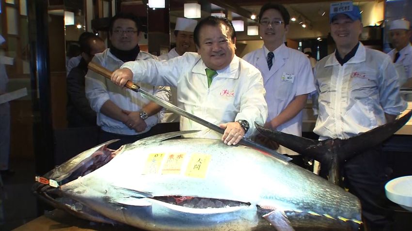 The world well known Tokyo Tsukiji fish market held its final first auction of the year Tuesday morning before its relocation scheduled for late 2016. The owner of a chain of sushi restaurant, Kiyoshi Kimura won the year?s first bit and paid 14 million yen ($117,000) for a 200 kilogram Bluefin tuna which is about 10 million yen higher than previous year. The tuna was caught off Oma, Aomori prefecture, in northern Japan. Kimura, president of Kimura Co.has won the year?s first bit for the fifth consecutive year. He holds a record high bidding price with 154.4 million yen for a 222 kilogram Bluefin tuna in 2013. Tsukiji fish market, one of the biggest fish market in the world was 80 years old, built in 1935. The tuna auctions there have become a popular tourist attraction in recent years. Kimura told reporters ?It is great tuna, splendid quality? ?Thinking of this first new year auction would be the last one at Tsukiji fish market, I feel it is significant? ?I would like our customers enjoy eating as many as possible?