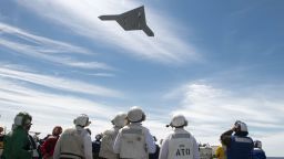 In this handout released by the U.S. Navy, An X-47B Unmanned Combat Air System (UCAS) demonstrator flies over the flight deck of the aircraft carrier USS George H.W. Bush (CVN 77) May 14, 2013 in the Atlantic Ocean. 