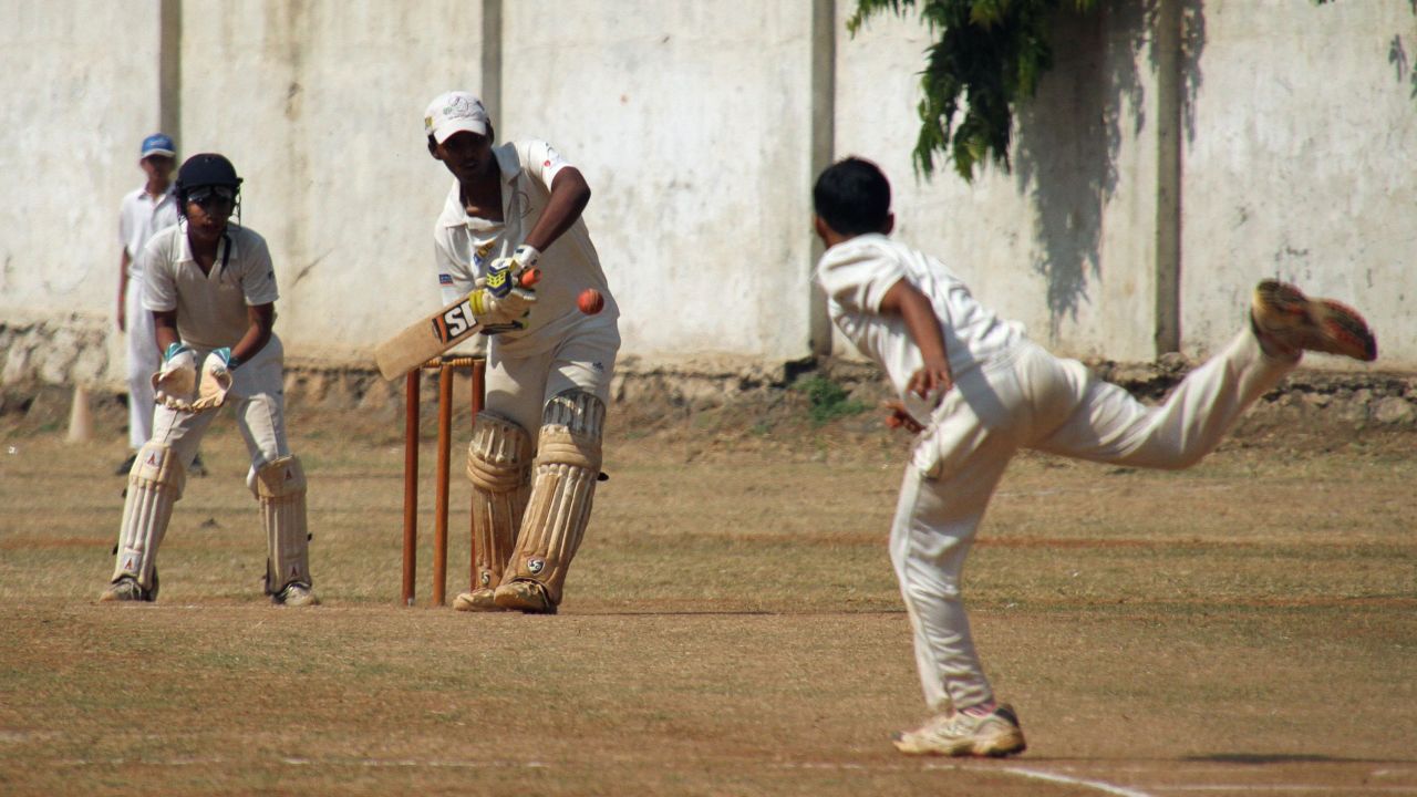 Mumbai schoolboy Pranav Dhanawade (C), 15, hits a shot as he smashed a 117-year-old record for the highest number of runs scored in one innings in Mumbai on January 5, 2016. A Mumbai schoolboy made history on January 5 when he became the first batsman in any class of cricket to score 1,000 runs in a single innings, with Indian legend Sachin Tendulkar leading the plaudits.  Dhanawade smashed his way to 1,009 not out off 323 balls.   AFP PHOTO / AFP / STR        (Photo credit should read STR/AFP/Getty Images)