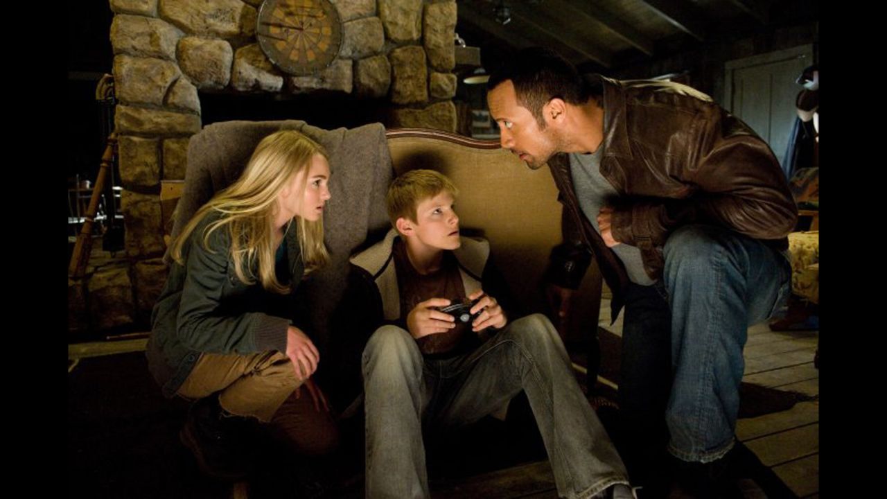 Johnson has successfully mixed action flicks with Disney movies such as the 2009 remake of "Race to Witch Mountain," here with AnnaSophia Robb and Alexander Ludwig. His cab driver role even sparked a meme.