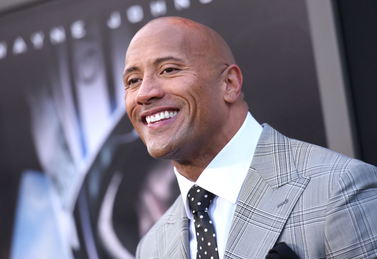 Many claim to be the "hardest-working man in show business," but few walk the walk like Dwayne Johnson. The man with the big guns and the million-watt smile has come a long way from his days as wrestling superstar The Rock. Here are some highlights from his career. 
