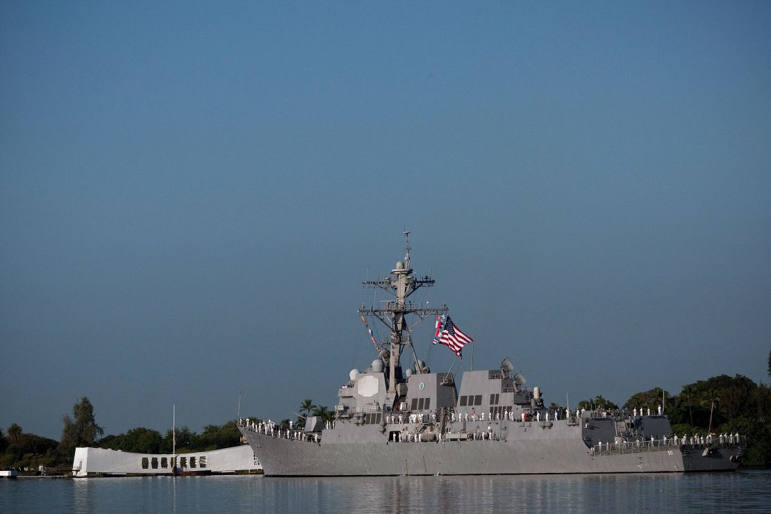 The USS Chafee does a Pass-in-review of the Arizona Memorial in 2010, on the 69th anniversary of the attack on Pearl Harbor.