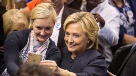 Democratic presidential candidate Hillary Clinton takes a selfie with a supporter during the New Hampshire Democratic Party Convention at the Verizon Wireless Center on September 19, 2015 in Manchester, New Hampshire.