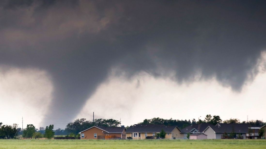 A large tornado passes just to the west of Halstead, Kansas, on May 6. As many as 178 tornadoes were reported across nine states from May 6-10.  The month of May sees more tornadoes than any other month in the United States.  <br />