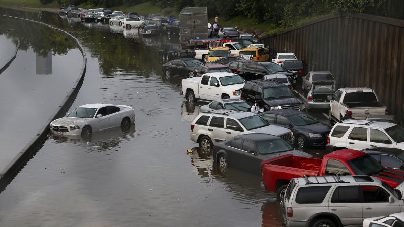 Vehicles are left stranded on flooded Interstate 45 in Houston, Texas on May 26. Heavy rains and flash flooding hit much of the state of Texas hard in late May, including in Dallas and Houston. The deluge helped to make 2015 the wettest year in Texas history, with records going back to 1895.<br />