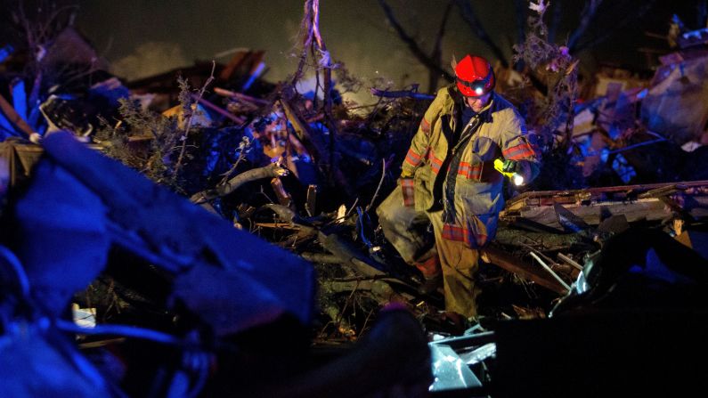 Crews search wreckage on State Route 72 after an EF-4 tornado came through Fairdale, Illinois, on April 9. It was the strongest of almost 50 tornadoes that occurred between April 7-9 across eight states. The tornado in Fairdale had winds up to 200 mph and left two people dead. 