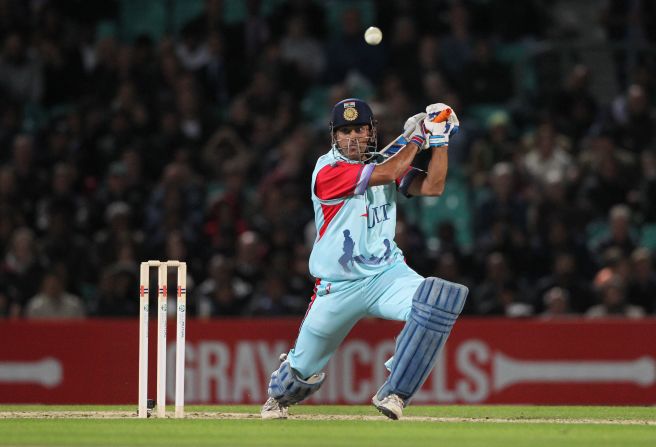 MS Dhoni smashes a boundary during a charity match at The Oval cricket ground in London last September. India's captain in limited-overs cricket said Pranav's incredible knock was "no joke." <br /><br />"Scoring 1,009 runs is not a joke. It's a tremendous effort and shows a glimpse of talent," Dhoni told reporters, AFP reported.