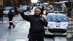 A French police officer redirects traffic at the Boulevard de Barbes in the north of Paris on January 7, 2016, after police shot a man dead as he was trying to enter a police station in the Rue de la Goutte d'Or. A witness told AFP he had heard "two or three shots" in the incident that occurred a year to the day of the jihadist attack on satirical newspaper Charlie Hebdo. The man attempting to attack the police station cried 'Allahu Akbar', was armed with a knife and wore an apparent explosives vest. AFP PHOTO / LIONEL BONAVENTURE / AFP / LIONEL BONAVENTURE        (Photo credit should read LIONEL BONAVENTURE/AFP/Getty Images)