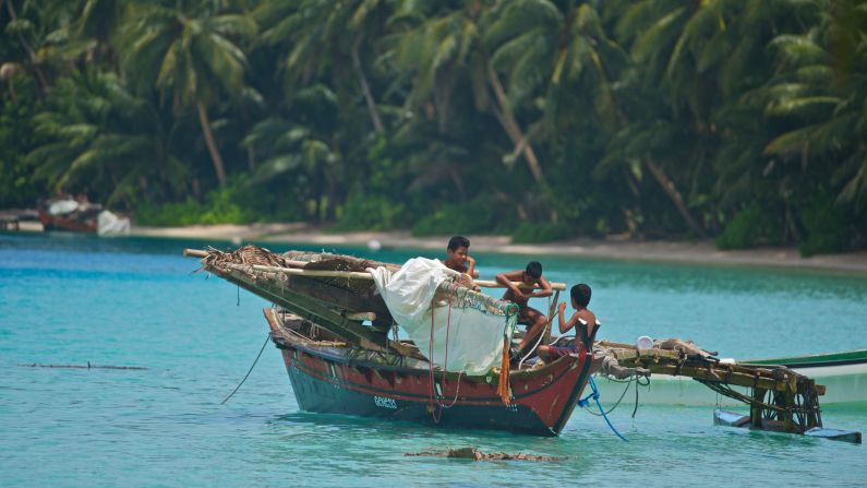 By the age of seven or eight, Lamotrek Atoll's boys will typically be at sea handling their own outrigger canoes and fishing. 