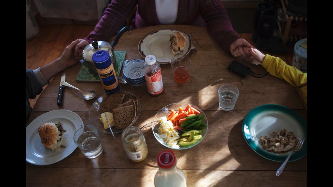 A family has lunch together in 2012.