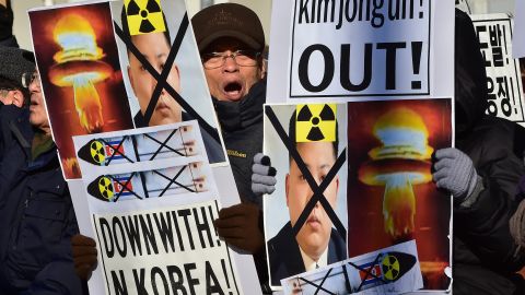 South Korean conservative activists shout slogans with placards showing portraits of North Korean leader Kim Jong-Un during a rally denouncing North Korea's hydrogen bomb test, in Seoul on January 7, 2016. The US and South Korean presidents vowed on January 7 to impose the "most powerful and comprehensive" sanctions on North Korea after its globally condemned fourth nuclear test. AFP PHOTO / JUNG YEON-JE / AFP / JUNG YEON-JE (Photo credit should read JUNG YEON-JE/AFP/Getty Images)