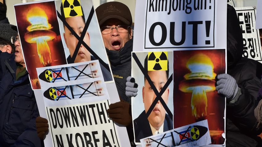 South Korean conservative activists shout slogans with placards showing portraits of North Korean leader Kim Jong-Un during a rally denouncing North Korea's hydrogen bomb test, in Seoul on January 7, 2016. The US and South Korean presidents vowed on January 7 to impose the "most powerful and comprehensive" sanctions on North Korea after its globally condemned fourth nuclear test. AFP PHOTO / JUNG YEON-JE / AFP / JUNG YEON-JE        (Photo credit should read JUNG YEON-JE/AFP/Getty Images)