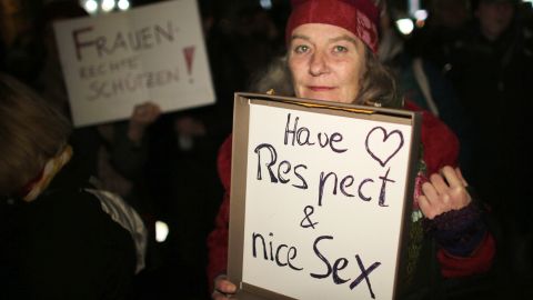 A woman holds a sign during a demonstration in Cologne after a wave of attacks on women over New Year's Eve.