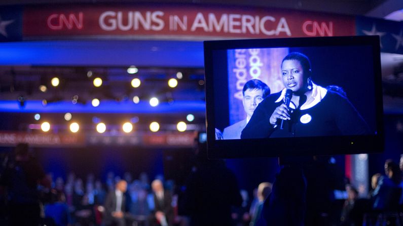 Cleopatra Cowley-Pendleton, mother of slain Chicago teen Hadiya Pendleton, is seen on a television monitor asking Obama a question.