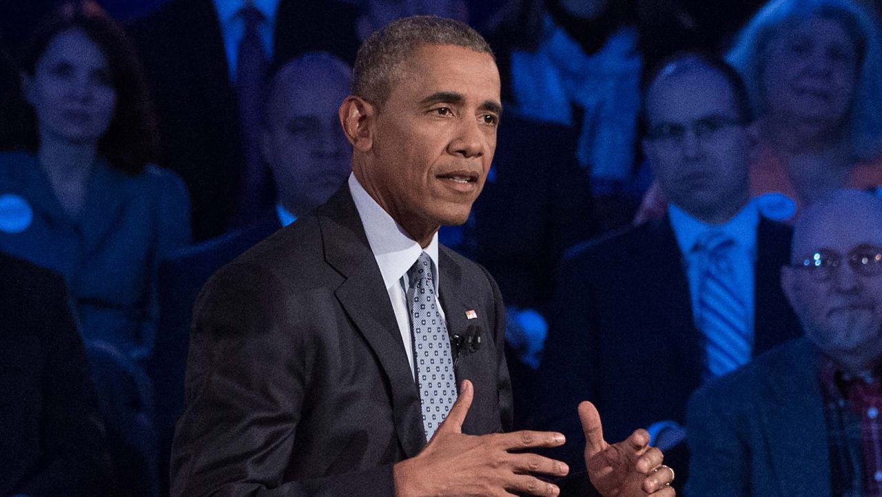 US President Barack Obama speaks at a town hall meeting with CNN's Anderson Cooper on reducing gun violence at George Mason University in Fairfax, Virginia, on January 7, 2016. Obama announced limited measures two days ago to tackle rampant US gun violence and called on Americans to punish lawmakers who oppose more meaningful reforms.   AFP PHOTO/ NICHOLAS KAMM / AFP / NICHOLAS KAMM        (Photo credit should read NICHOLAS KAMM/AFP/Getty Images)