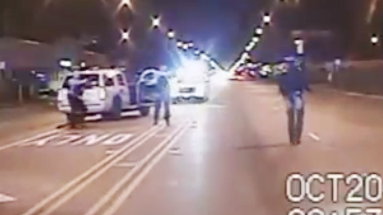 FILE - In this Oct. 20, 2014 frame from dash-cam video provided by the Chicago Police Department, Laquan McDonald, right, walks down the street moments before being shot by officer Jason Van Dyke 16 times in Chicago. Chicago officials released hundreds of emails Thursday Dec. 31, 2015 related to the video that wasn't released until more than a year after the shooting. The emails, including some between city officials asking how they should respond to demands for the video, were released to media outlets that have been pressing for the documents for weeks. (Chicago Police Department via AP, File)