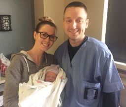 New parents, Kelley and Aaron McKissack, pose with their daughter Kelcey.