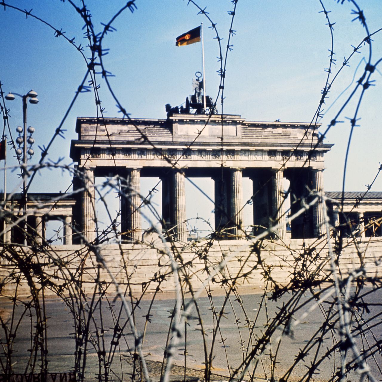 It's 1968, and Berlin's Brandenburg Gate is seen through a swirl of barbed wire. BFC came to represent football power in the east of the divided city.