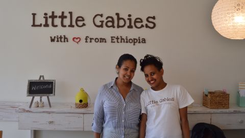 Amelsa Yazew, (L) founder of baby boutique Little Gabies poses with Tensae who works in the shop.