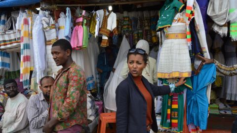 Abai Schulze haggles at  Addis Ababa's large market for traditional Ethiopian clothes, Shiro Meda.