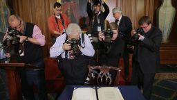 Journalists photograph legislation to repeal the Affordable Care Act, also known as Obamacare, and to cut off federal funding of Planned Parenthood that had just been signed by Speaker of the House Paul Ryan on January 7, 2016.
