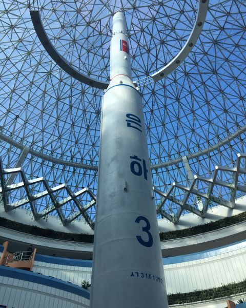 The building is centered around a replica of the rocket that launched North Korea's one and only satellite in 2012. 