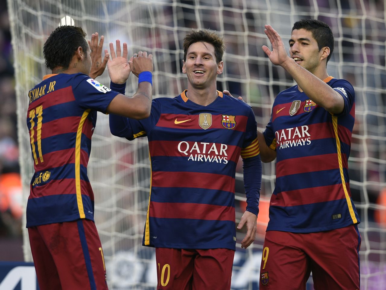 The potent striking trinity of Messi (C) Neymar (L) and Suarez celebrate after closing out the game in style.