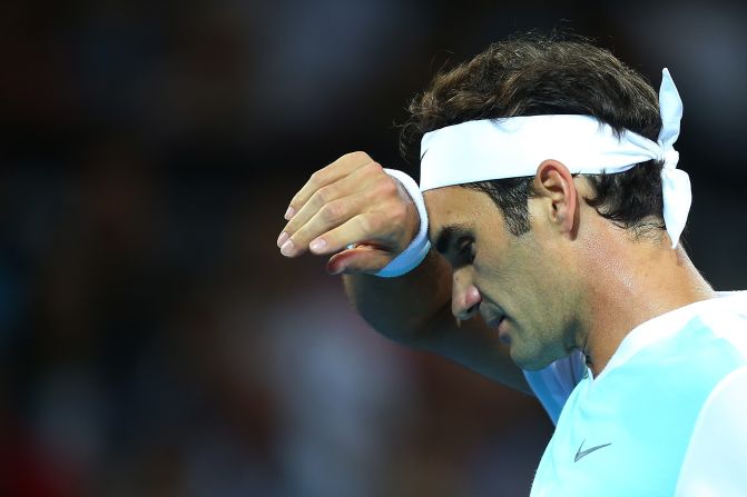 A weary Roger Federer slips to defeat against Milos Raonic of Canada in the final of the Brisbane International tournament.