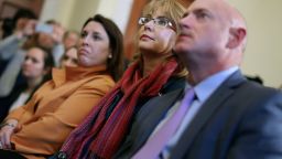 Former Congresswoman and handgun violence survivor Gabby Giffords (C), her husband Mark Kelly (R) and Americans for Responsible Solutions Executive Director Hayley Zachary attend a news conference about background checks for gun purchases at the Canon House Office Building on Capitol Hill March 4, 2015 in Washington, DC.