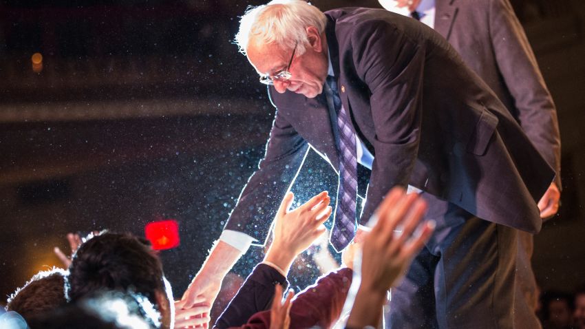 Democratic presidential candidate Sen. Bernie Sanders shakes hands with supporters after outlining his plan to reform the U.S. financial sector on January 5, 2016, in New York City.