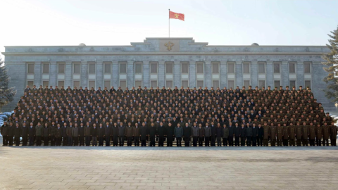North Korean leader Kim Jong Un poses with workers who contributed to the H-bomb test, reports KCNA.