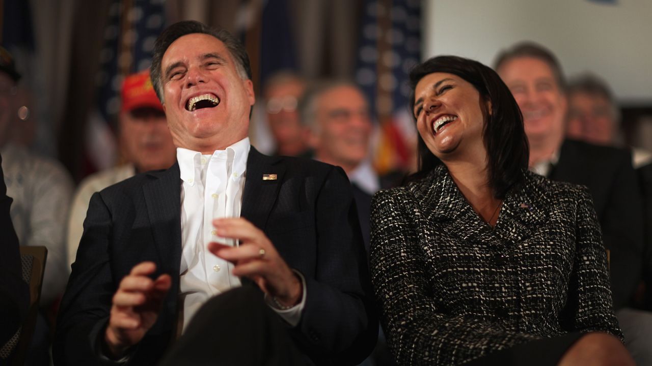 Former Massachusetts Gov. Mitt Romney and Haley laugh during a rally on January 13, 2012, on Hilton Head Island, South Carolina. 