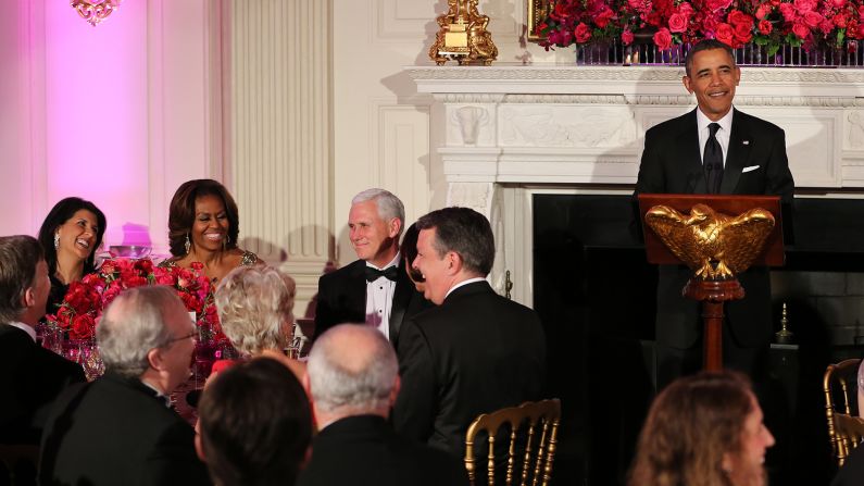 U.S. President Barack Obama speaks during the 2014 Governors' Dinner on February 23, 2014, in Washington as Haley, Michelle Obama and Gov. Mike Pence, R-Indiana, react.