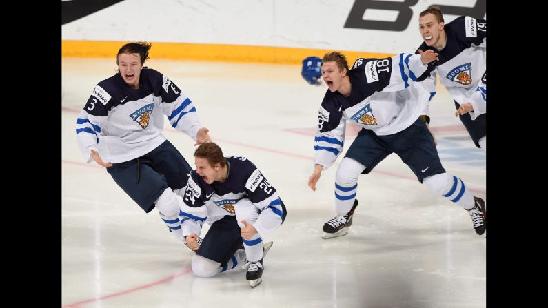 Finnish hockey players celebrate after Kasperi Kapanen, second from left, scored the game-winning overtime goal to beat Russia and win the World Juniors on Tuesday, January 5. The tournament took place in Helsinki, Finland.
