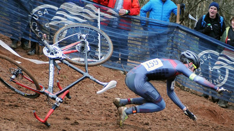 Charlie Hough falls off his bicycle Sunday, January 10, while competing in the Cyclocross National Championships in Asheville, North Carolina. He would go on to finish the race.