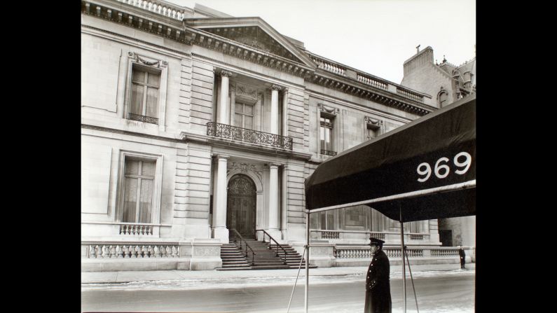 A doorman stands near New York's Fifth Avenue in 1938, across the street of what later would become part of New York University. In 1935, during the Great Depression, photographer Berenice Abbott proposed an art project to the federal government called "Changing New York." Her work was turned into a book in 1939, and <a href="index.php?page=&url=http%3A%2F%2Fdigitalcollections.nypl.org%2Fcollections%2Fchanging-new-york%23%2F%3Ftab%3Dabout" target="_blank" target="_blank">the high-resolution images</a> were among the projects recently released for download by the New York Public Library. Travel south down Fifth Avenue, as Abbott saw it in the 1930s.