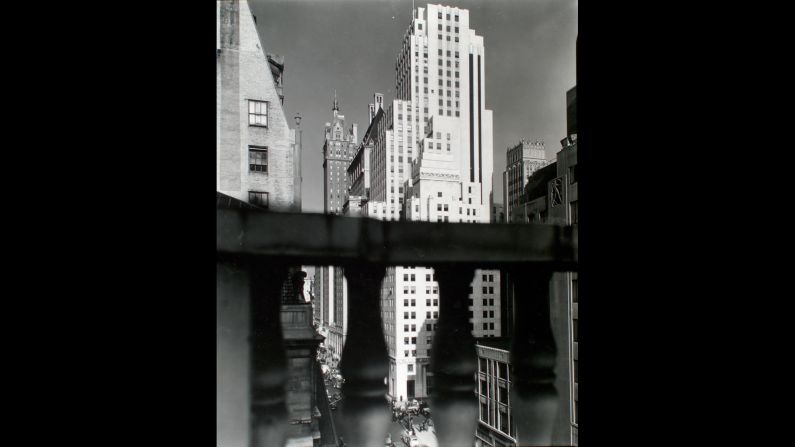 At the south end of Central Park, Abbott stopped to photograph the Squibb Building with the Sherry-Netherland hotel in the background. Abbott was a careful, technical photographer. When she couldn't find cameras or developers that achieved what she wanted, she designed and built her own.