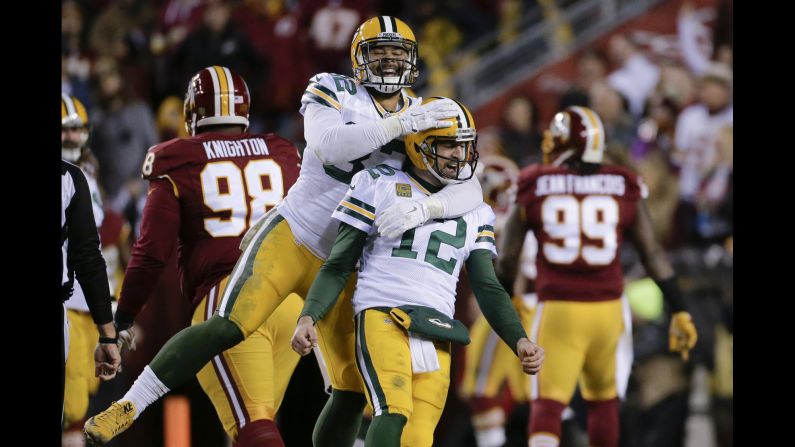 Green Bay tight end Richard Rodgers embraces quarterback Aaron Rodgers -- no relation -- after a touchdown against Washington on Sunday, January 10. Green Bay won 35-18 to advance to the next round of the NFL playoffs.