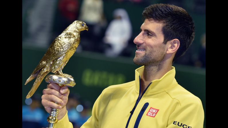Novak Djokovic, the world's top-ranked tennis player, holds his trophy after winning the Qatar Open on Saturday, January 9.