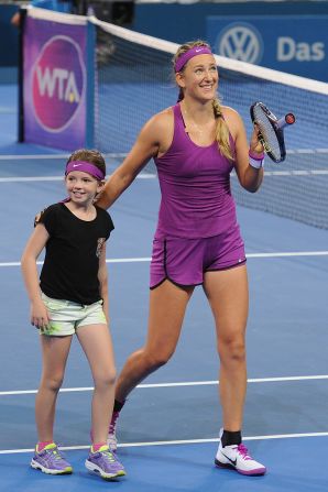 After capturing the Brisbane title, Azarenka brought a nine-year-old fan onto the court during the trophy presentation 