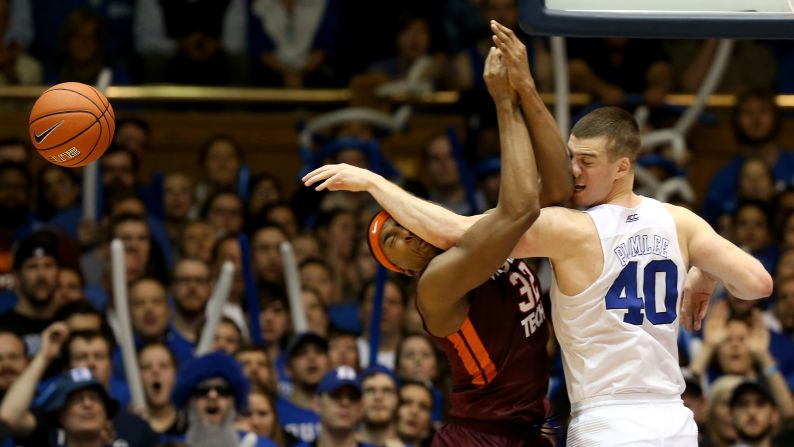 Duke's Marshall Plumlee, right, tips the ball away from Virginia Tech's Zach LeDay during a college basketball game in Durham, North Carolina, on Saturday, January 9.